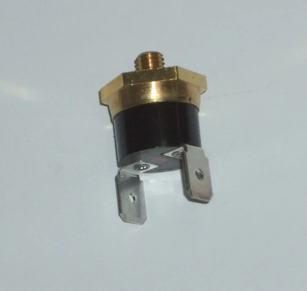 Thermostat mit Metallanschlüssen und schwarz-weißer Gehäusefarbe. Für den Einsatz in Heizsystemen, wie von der Marke Daikin, entwickelt.